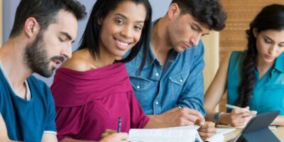 Happy students at library